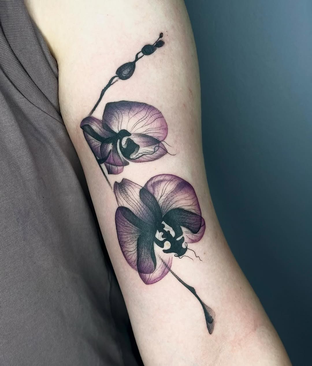 Elegant orchid tattoo with intricate details Tattoo Design