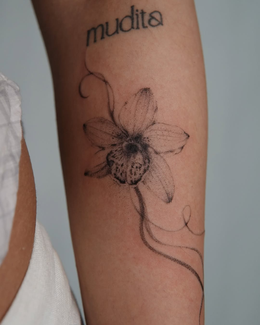 Elegant orchid tattoo with intricate details Tattoo Design