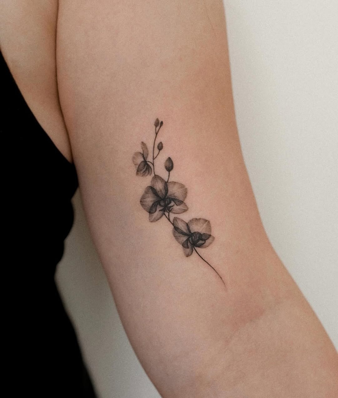 Elegantly unique black and white orchid tattoo Tattoo Design