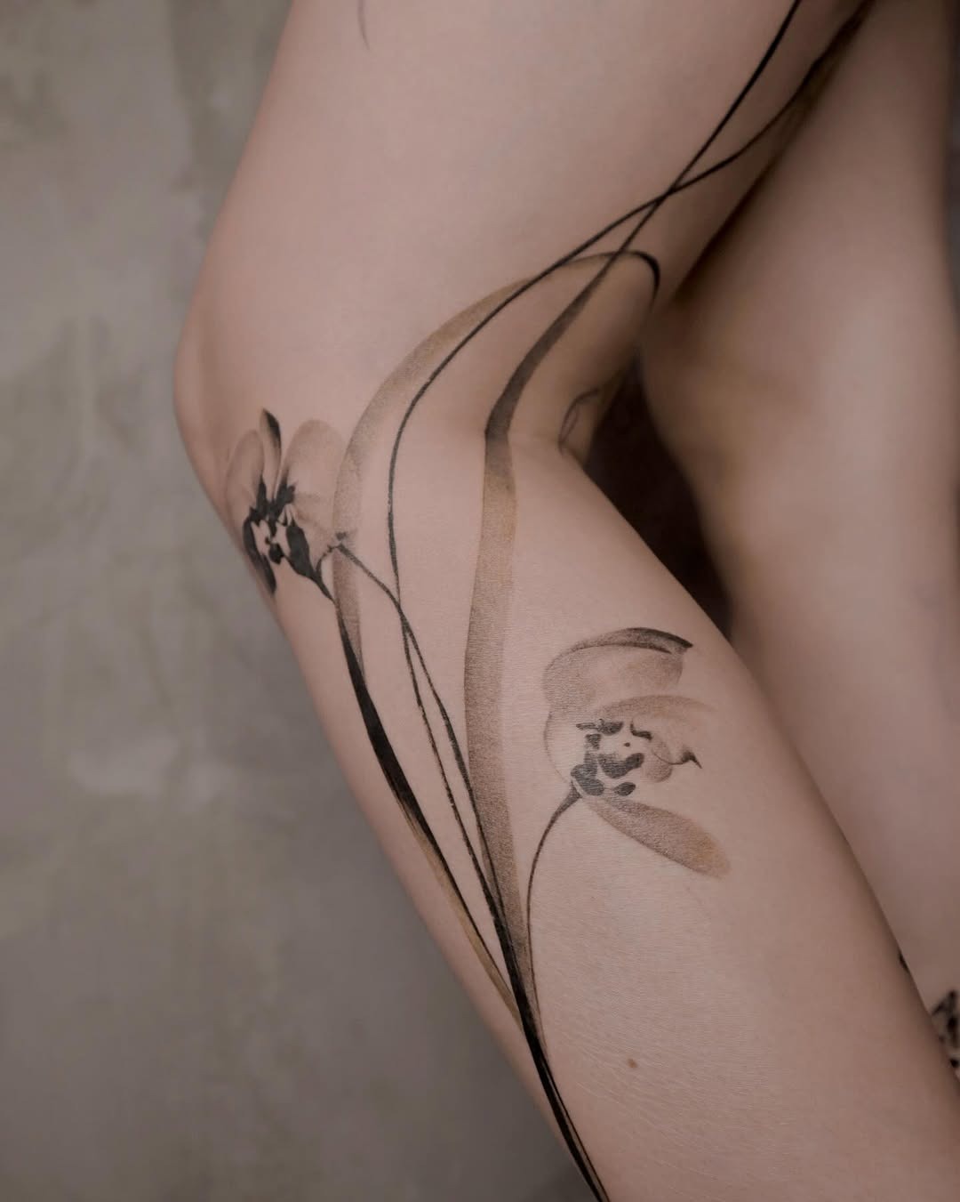 Stunning orchid tattoo with fluid lines Tattoo Design