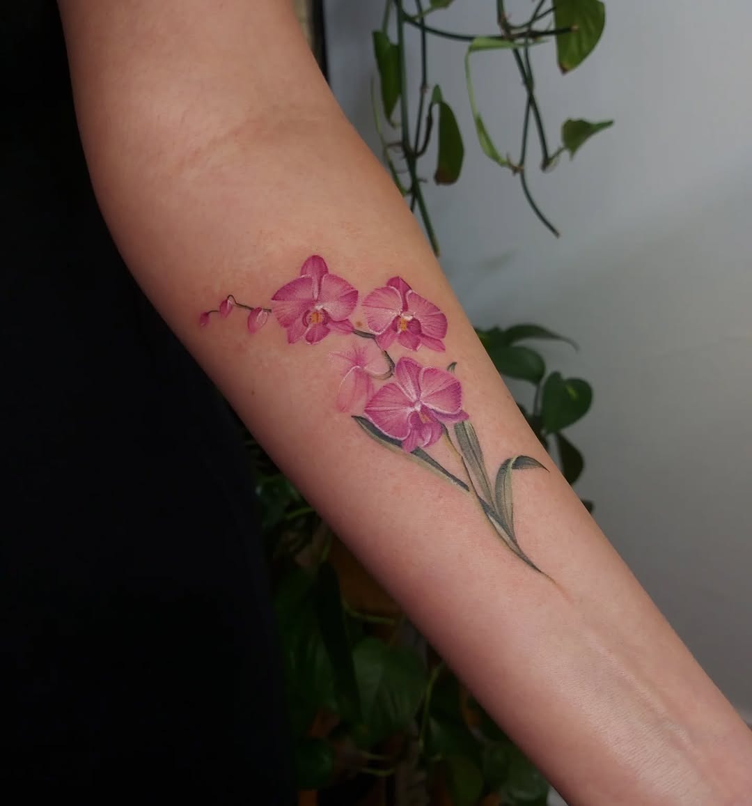 Stunning pink orchid tattoo on forearm Tattoo Design