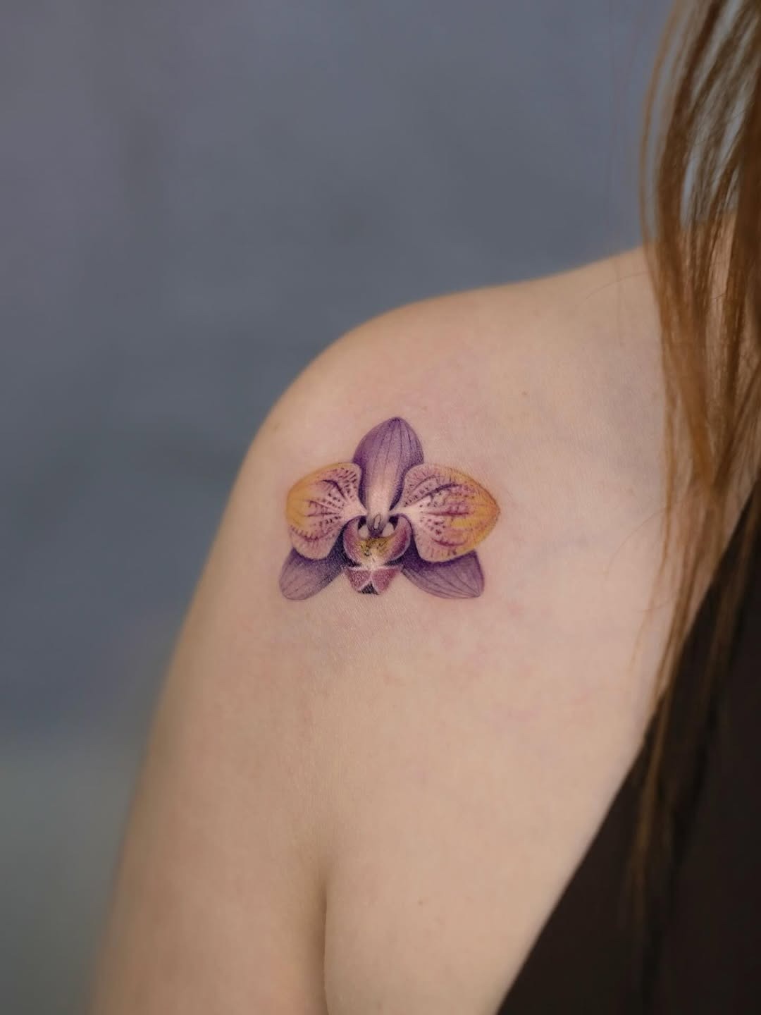 Stunning purple orchid tattoo on shoulder Tattoo Design
