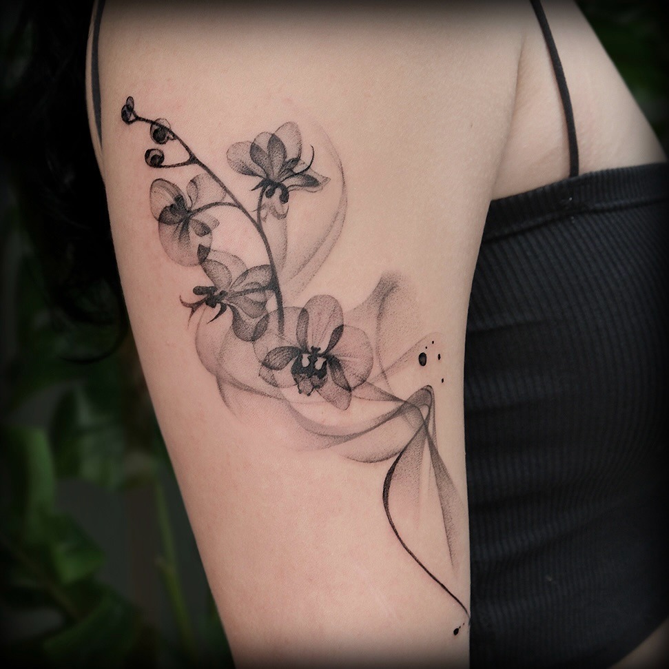 Stylish black orchid tattoo on arm Tattoo Design