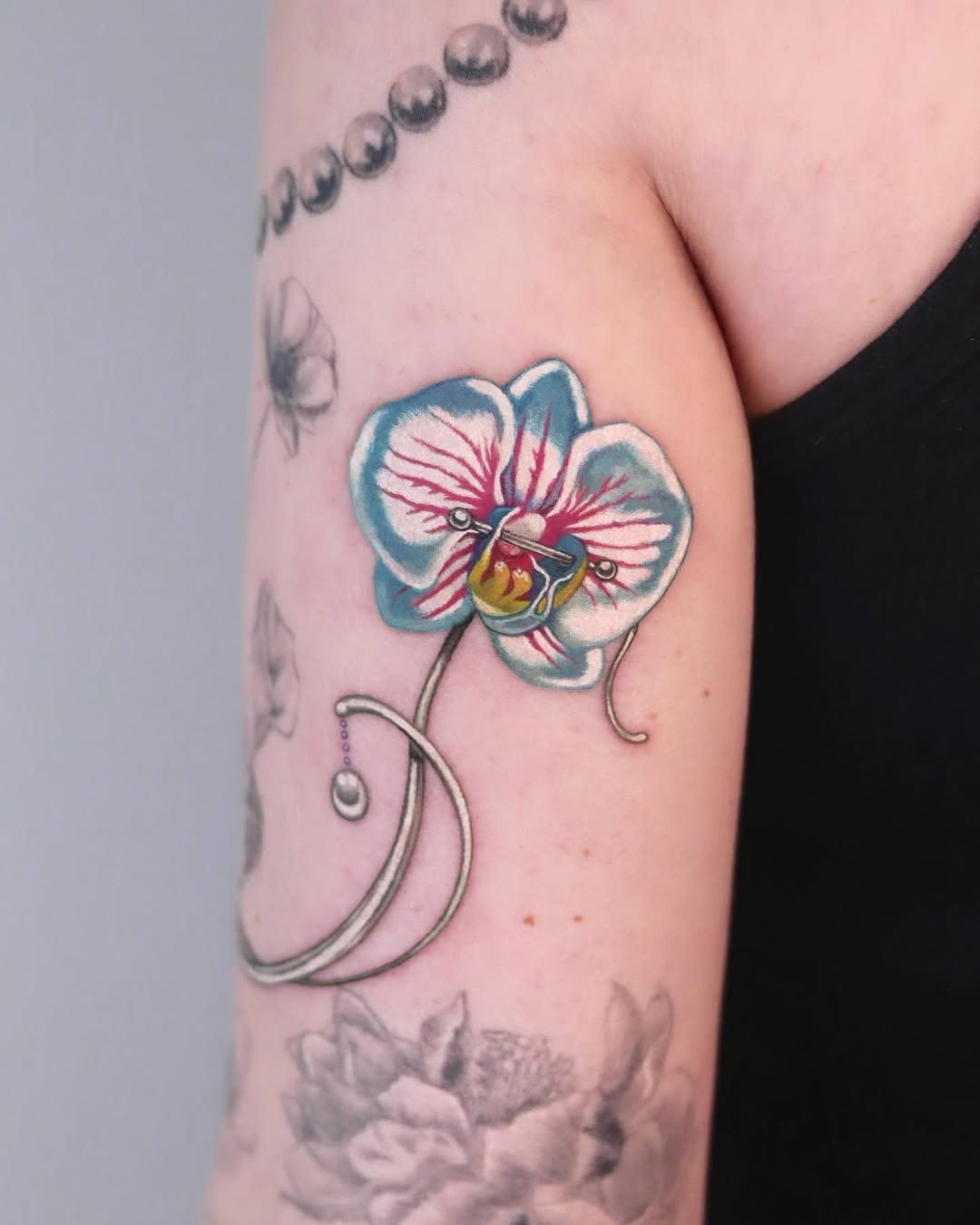 Vibrant orchid tattoo with intricate details Tattoo Design