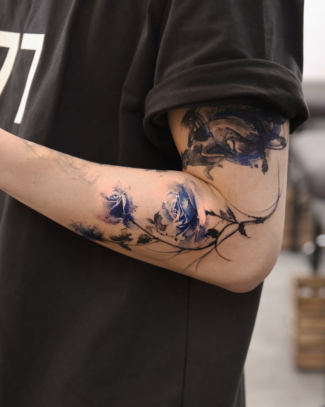 Elegant blue rose tattoo with artistic flair Tattoo Design