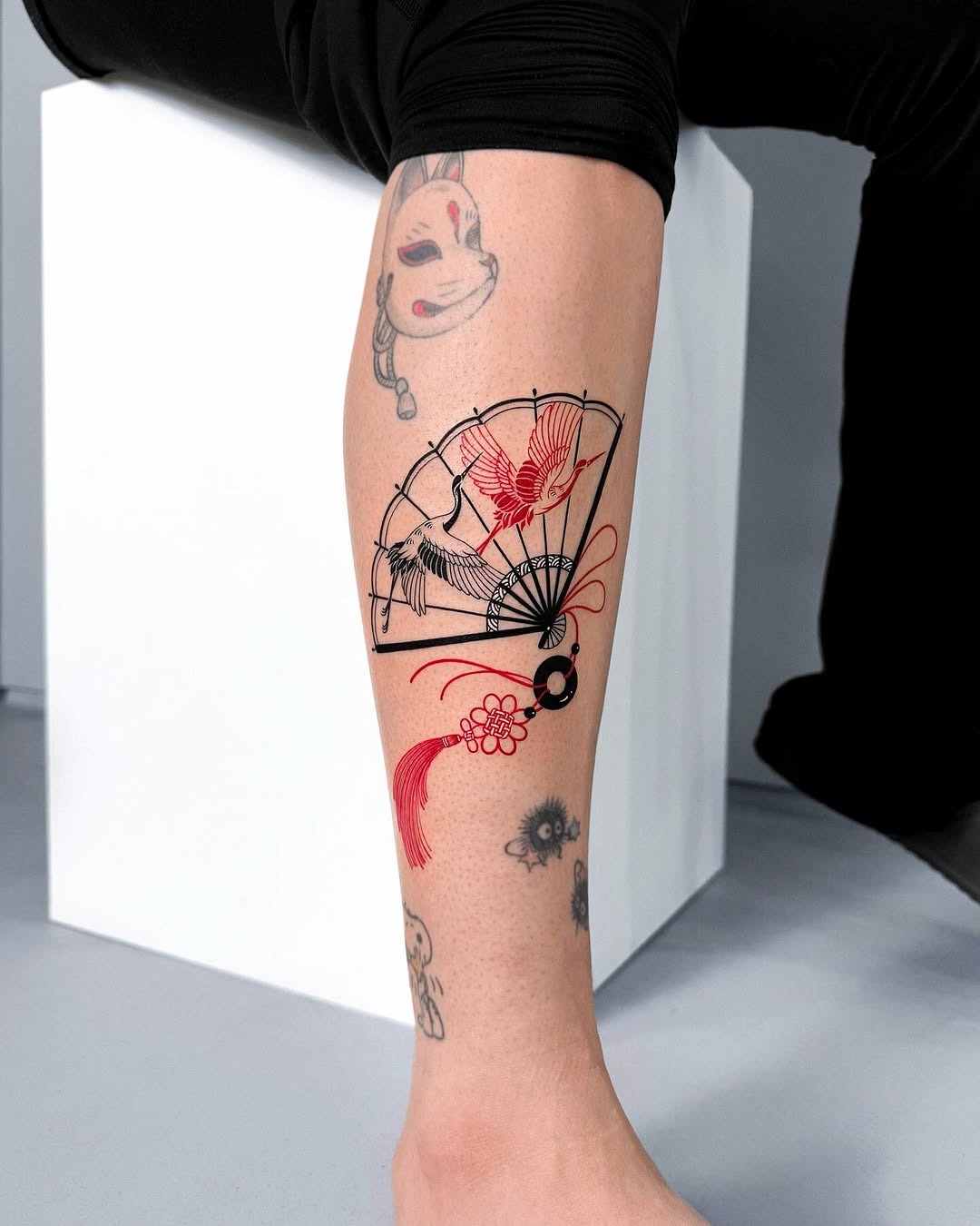 Elegant fan tattoo with a bold design Tattoo Design