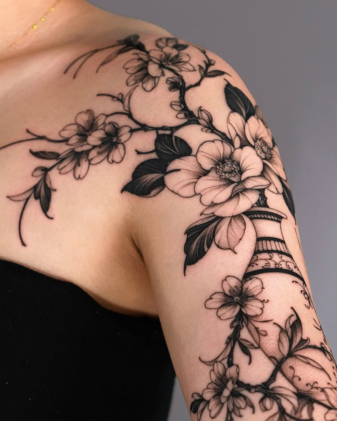 Elegant floral tattoo design on the arm Tattoo Design