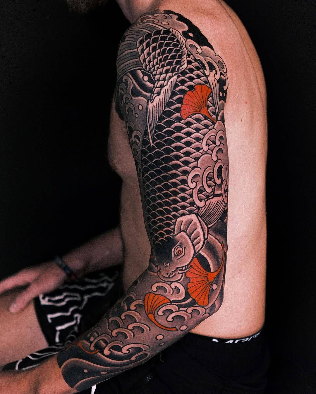 Elegant koi fish tattoo with wave motifs Tattoo Design