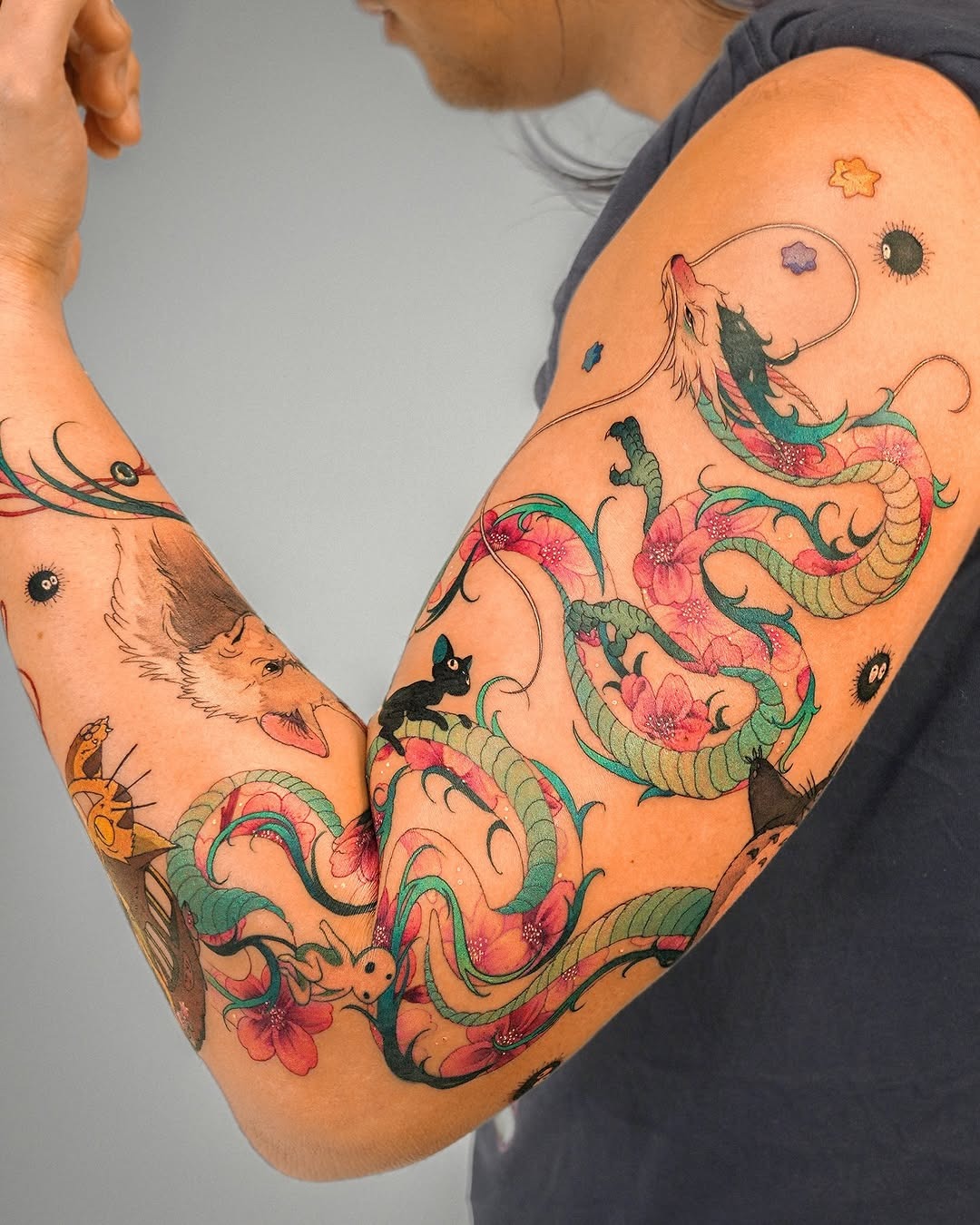 Intricate designs of colorful serpents and flowers Tattoo Design