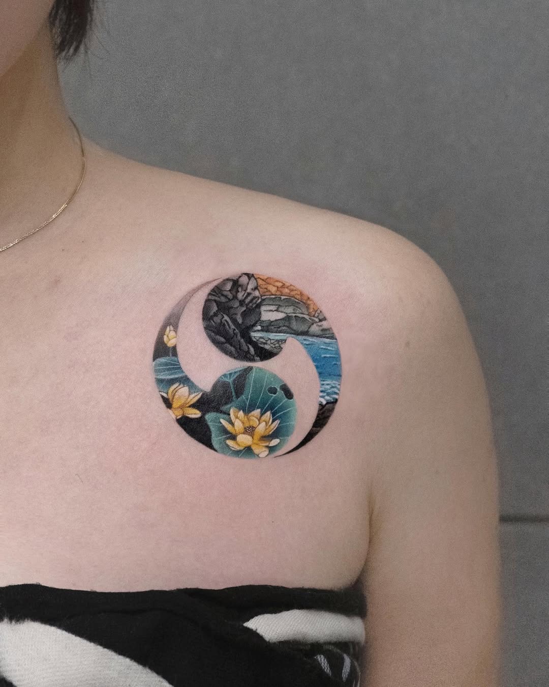 Intricate tattoo featuring lotus and waves Tattoo Design