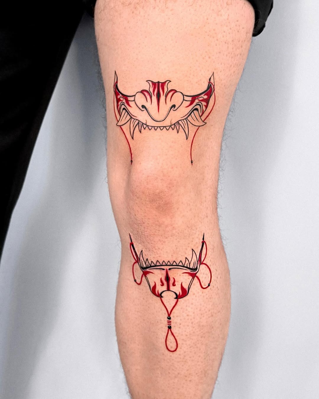 Striking red and black knee tattoo design Tattoo Design