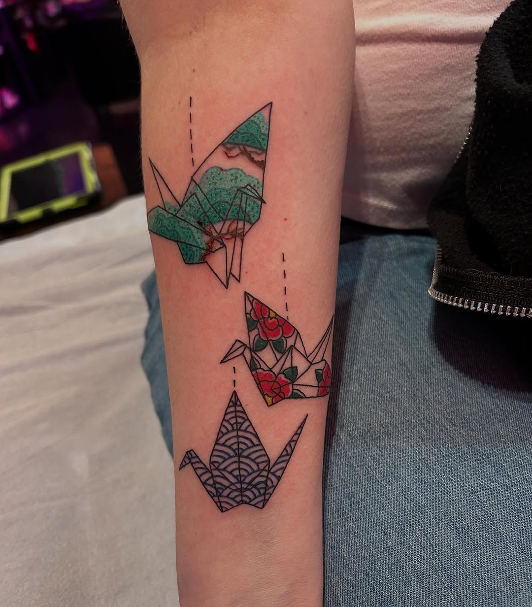Artistic Origami Cranes with Vibrant Details Tattoo Design