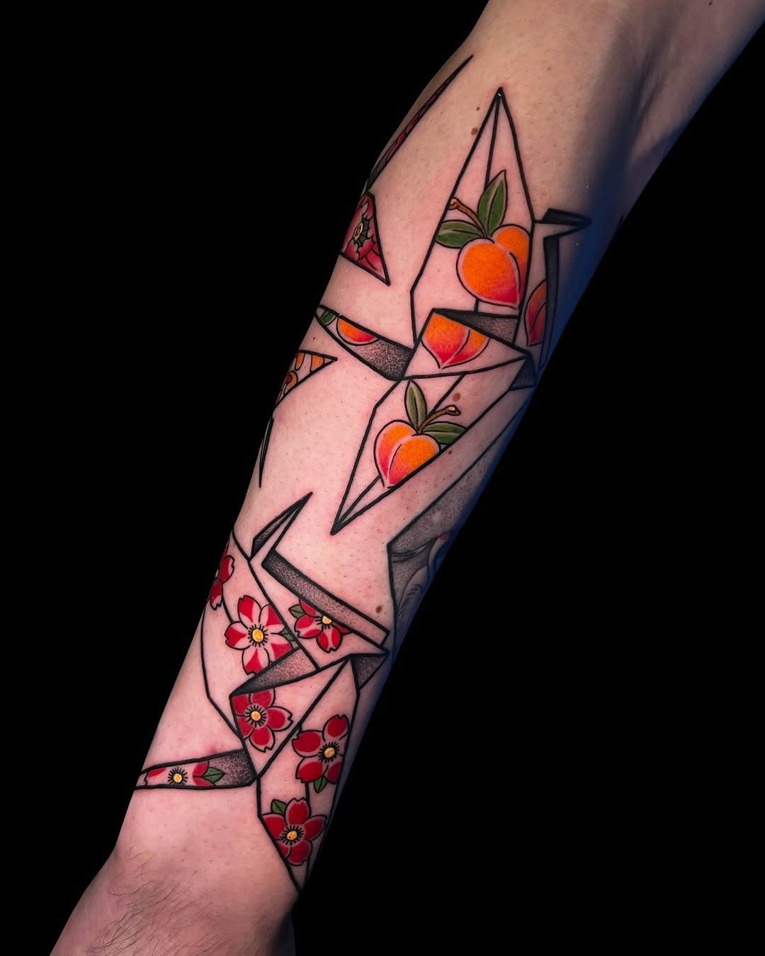 Colorful origami cranes tattoo adorns the arm Tattoo Design