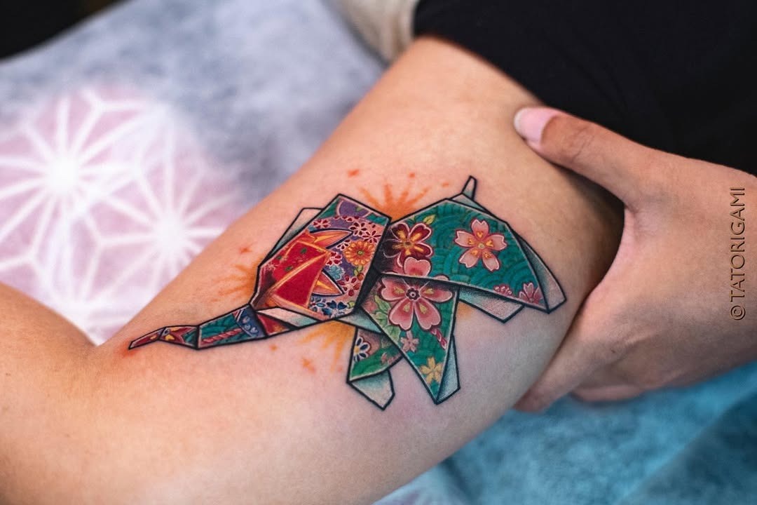Colorful origami elephant tattoo with floral design Tattoo Design