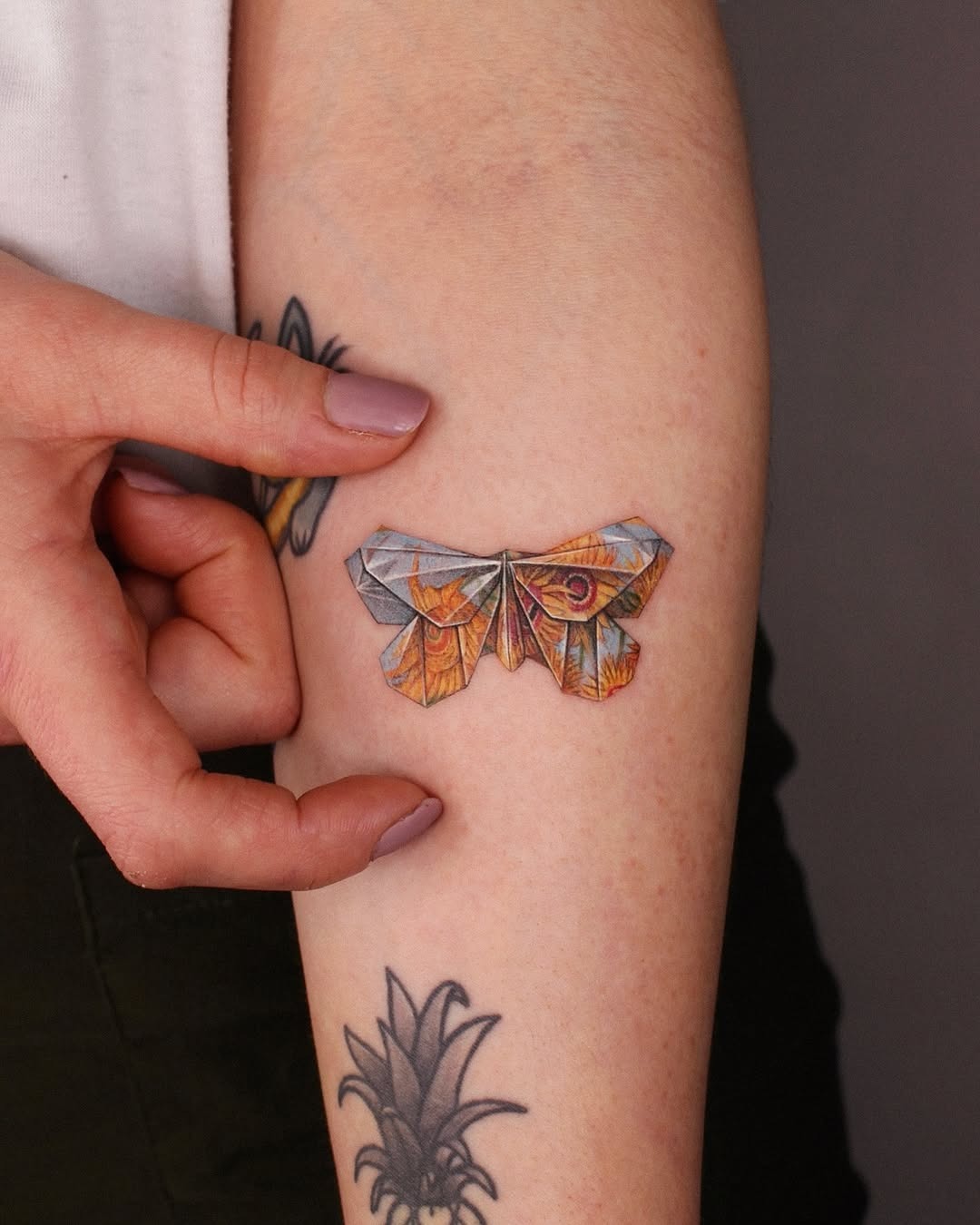 Colorful origami moth tattoo on the arm Tattoo Design
