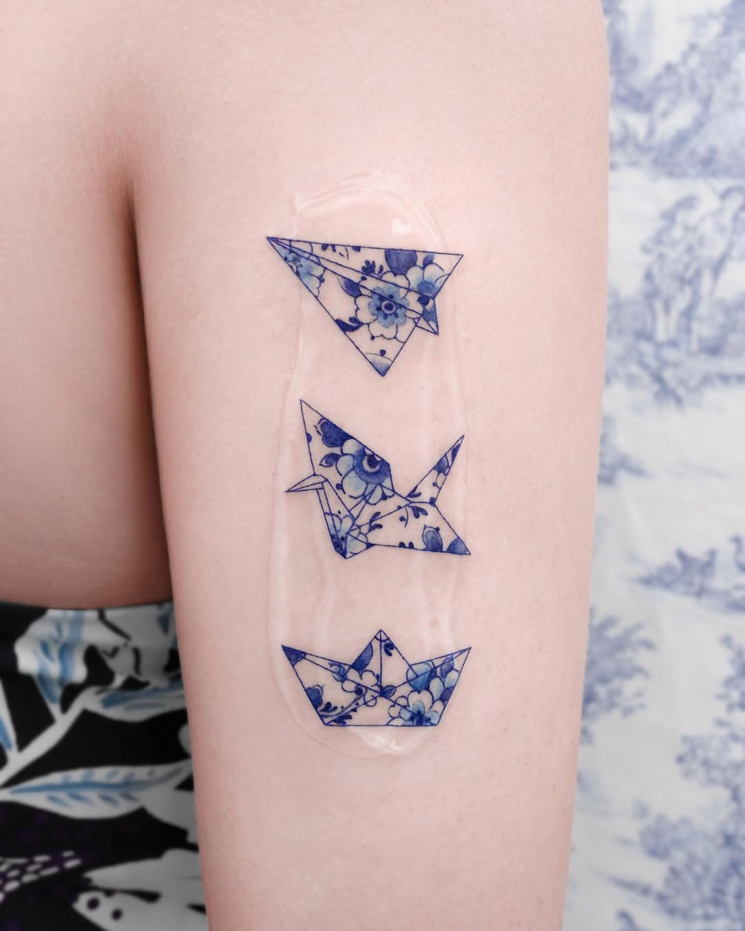 Delicate floral origami crane tattoo collection Tattoo Design