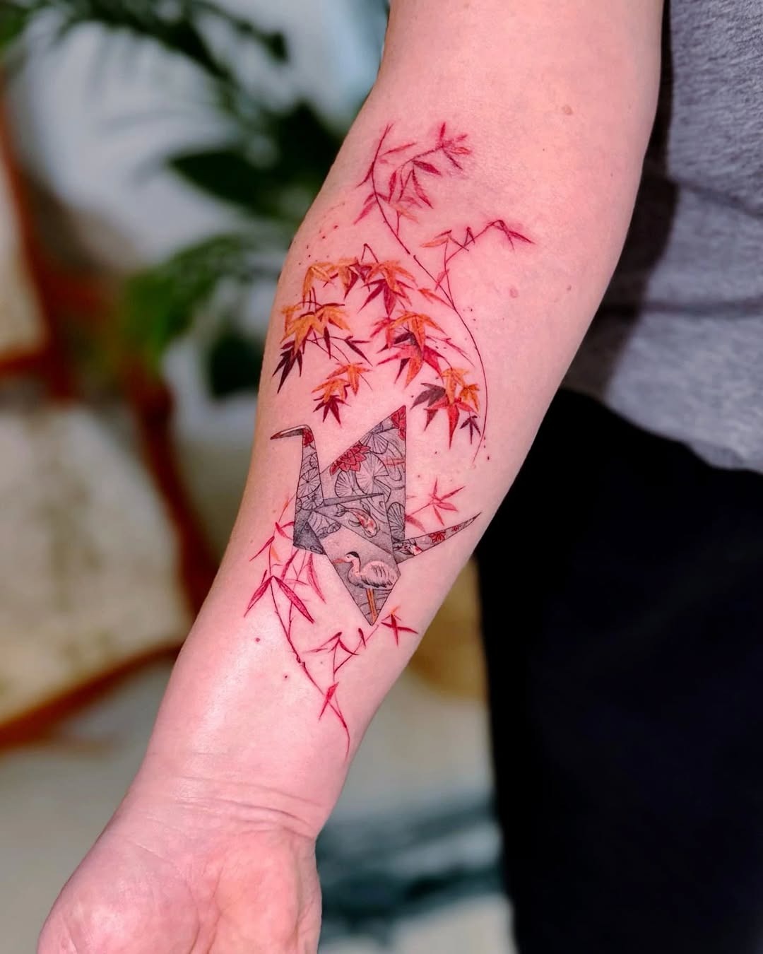 Elegant origami crane tattoo with autumn foliage Tattoo Design