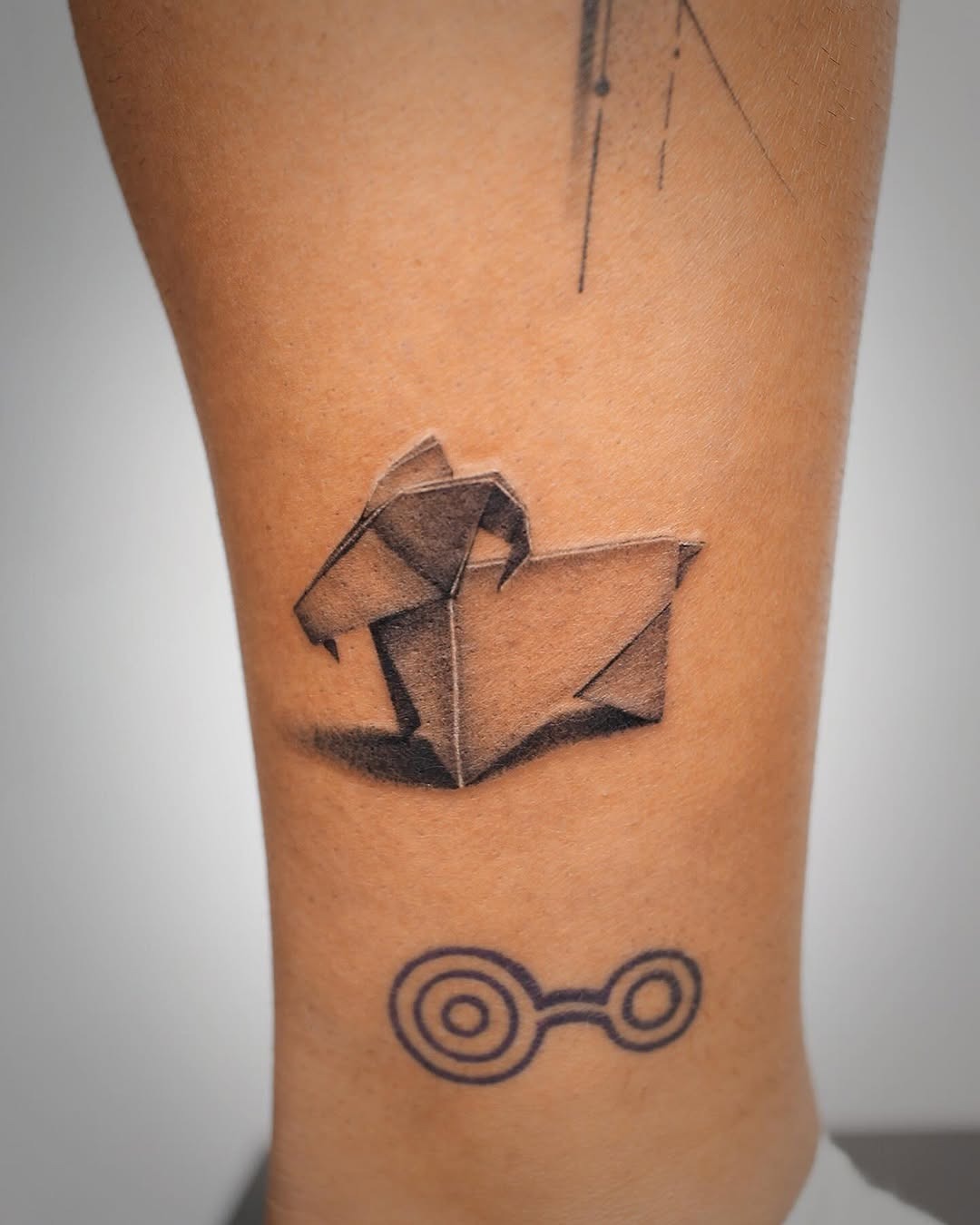 Elegant origami dog tattoo on the calf Tattoo Design