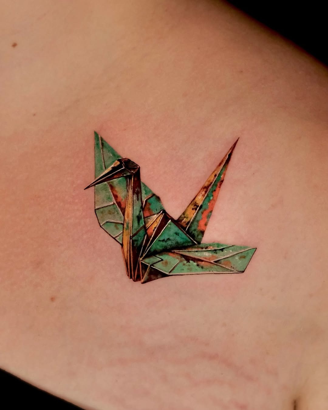 Stunning origami crane tattoo with vibrant colors Tattoo Design