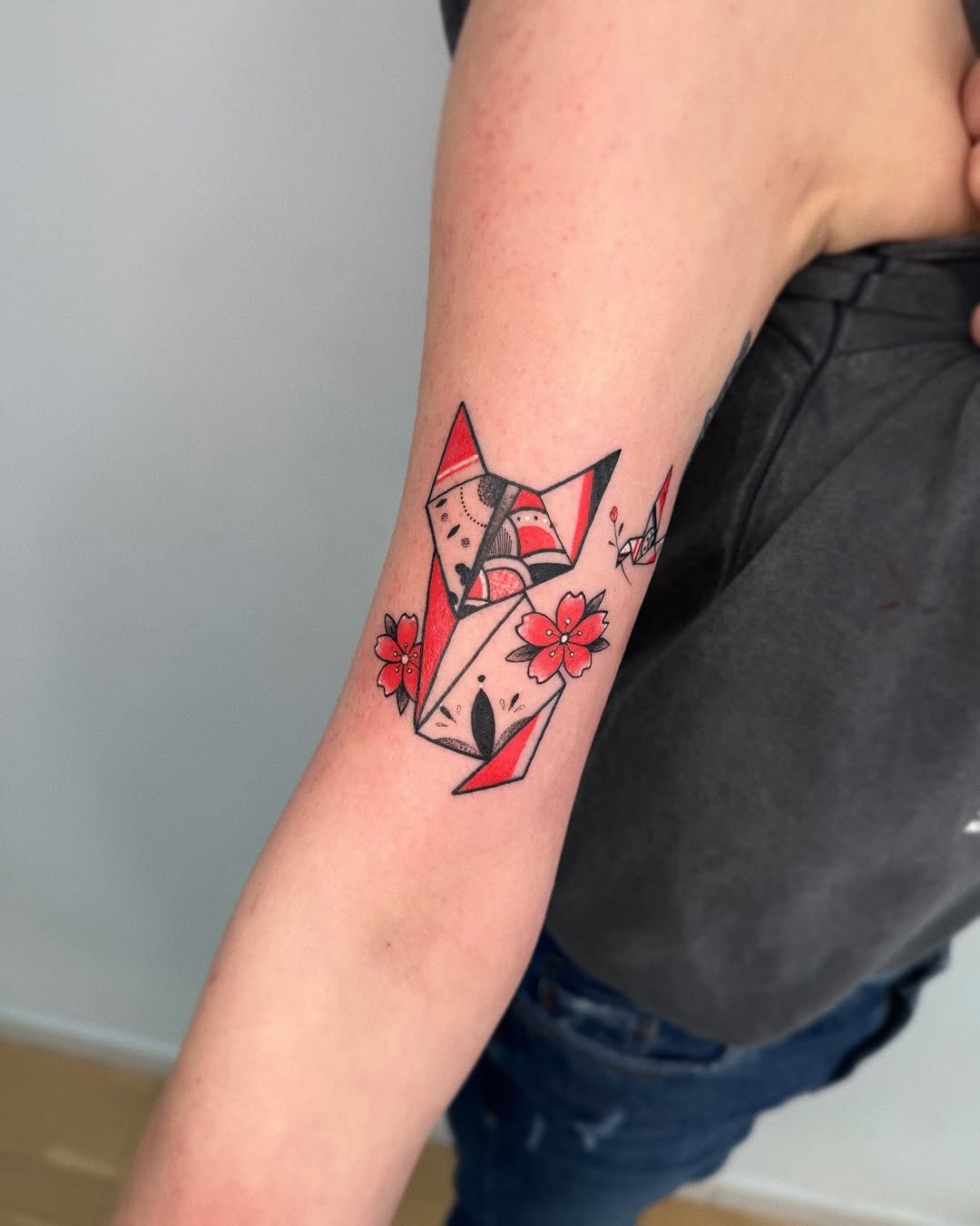 Vibrant origami fox tattoo with floral accents Tattoo Design