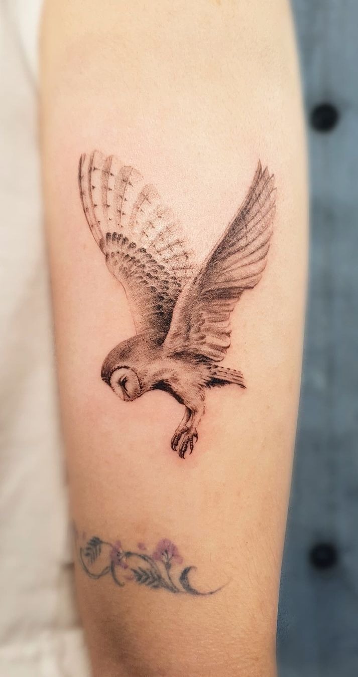 Tiny Realistic Owl in Flight Tattoo Design
