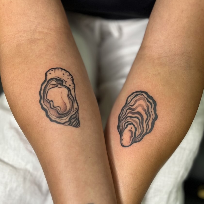These oyster tattoos showcase a beautiful minimalist design.