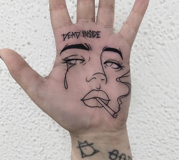Bold palm tattoo with a unique expression Tattoo Design
