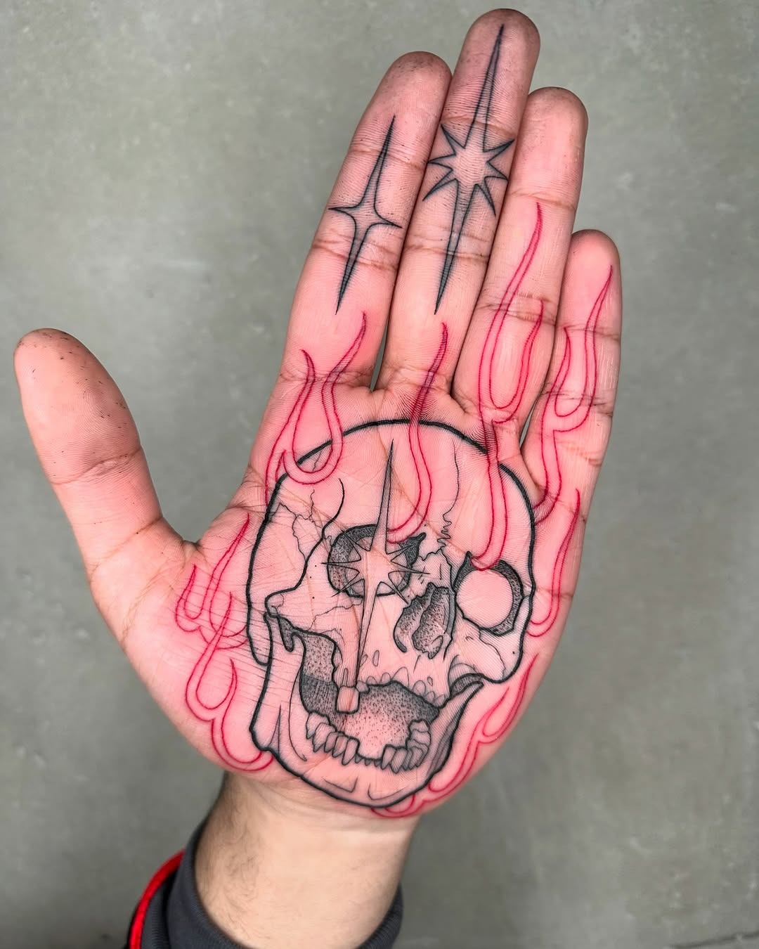 Bold skull and flame palm tattoo design Tattoo Design