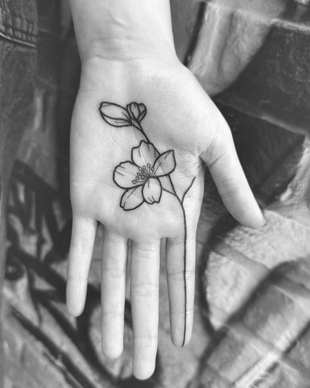 Delicate floral design on palm tattoo Tattoo Design