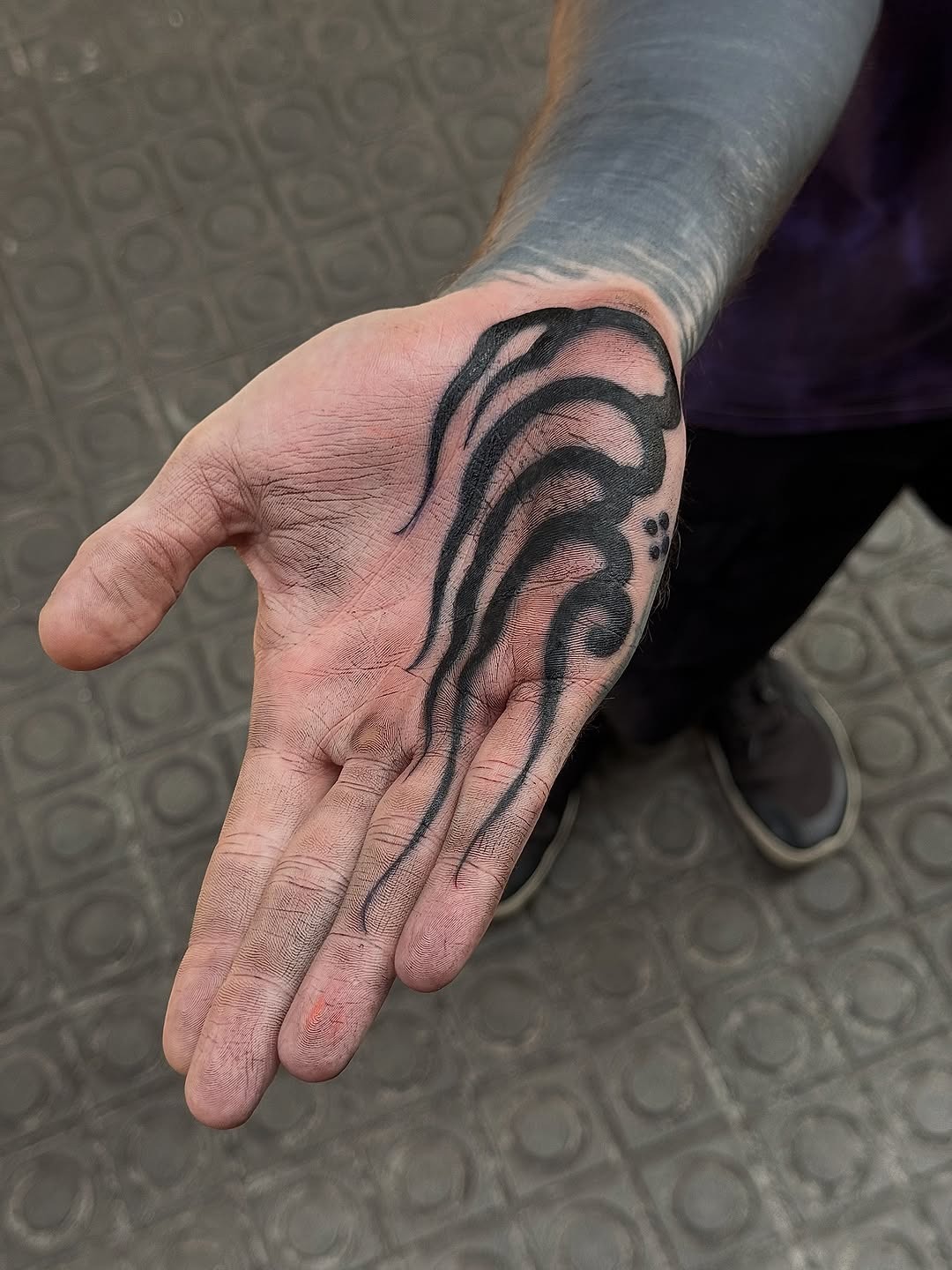 Intricate black ink palm tattoo design Tattoo Design