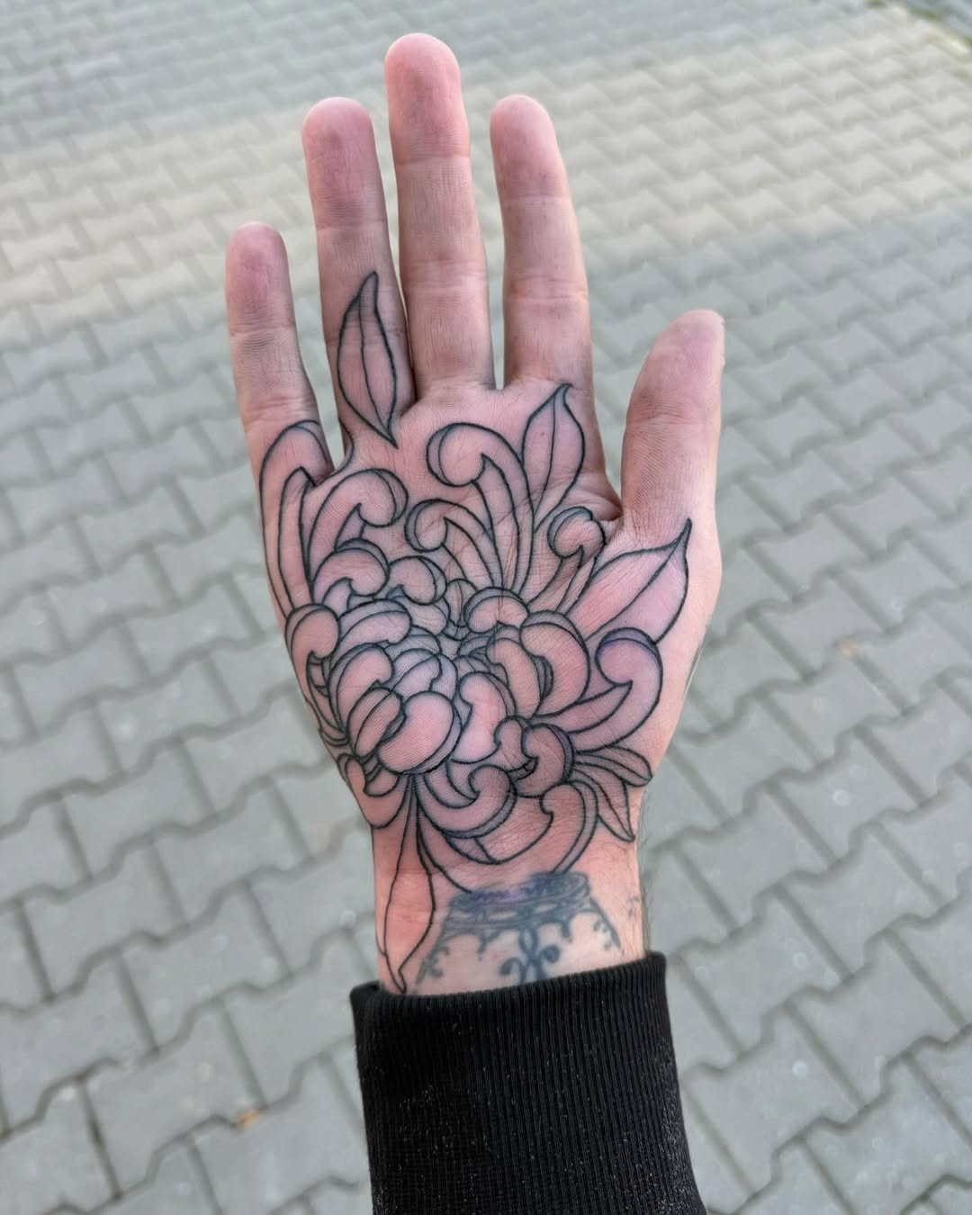 Intricate floral design on palm tattoo Tattoo Design