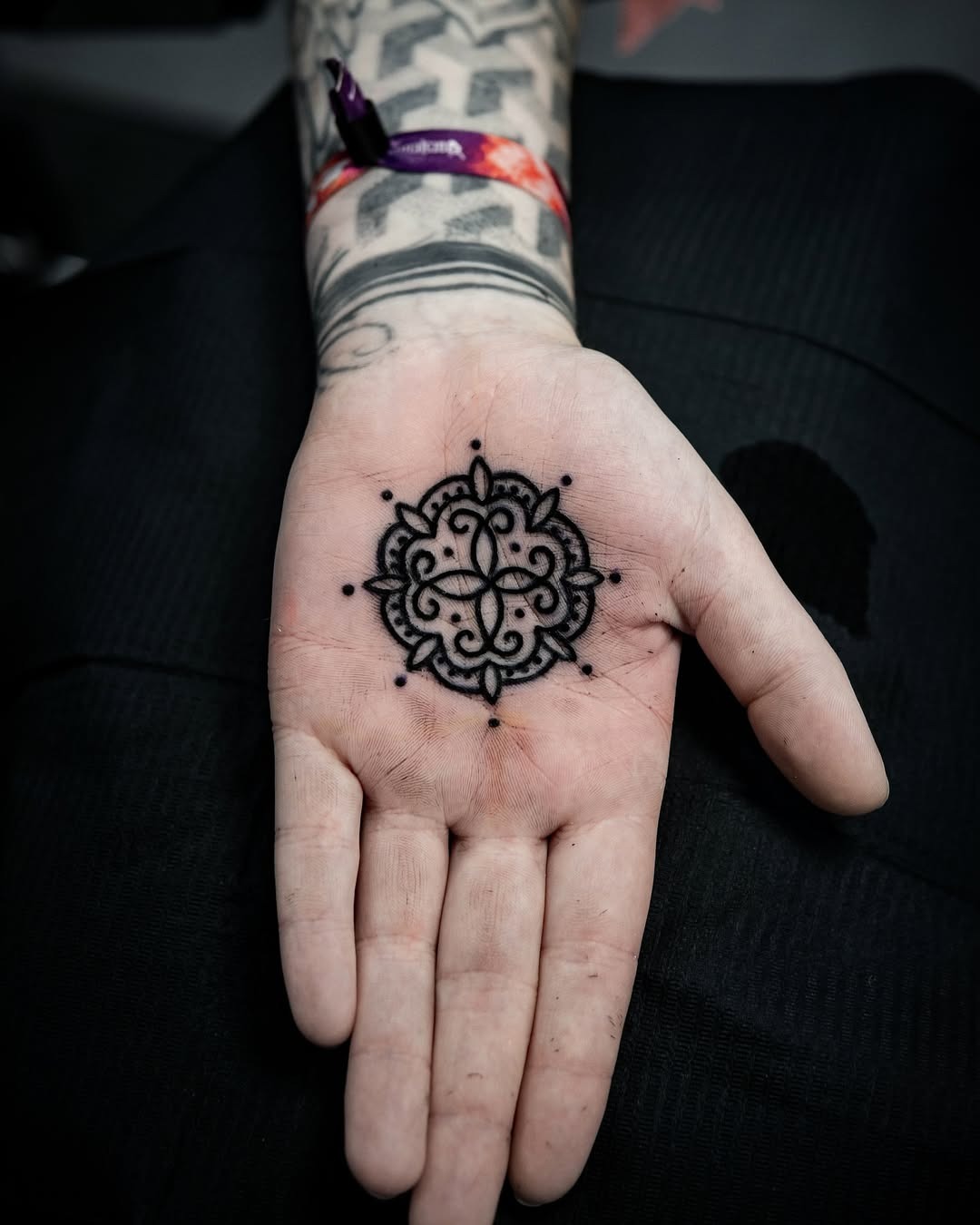 Intricate mandala palm tattoo in black ink Tattoo Design