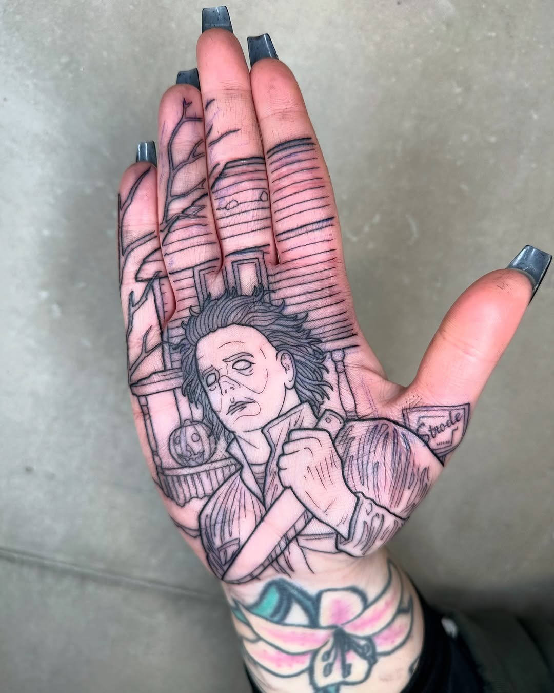 Intricate palm tattoo of horror icon Michael Myers Tattoo Design