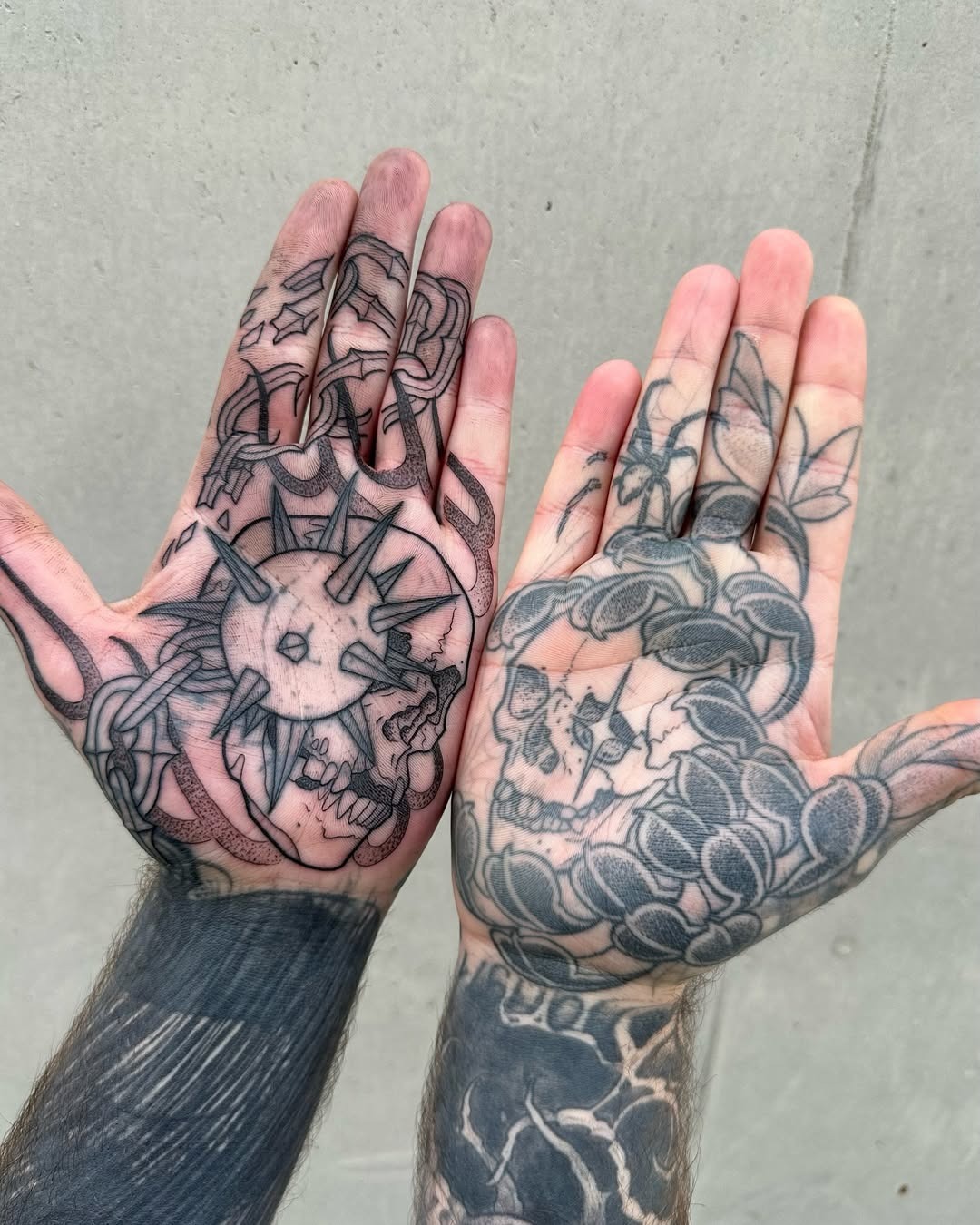 Intricate palm tattoos blending nature and skulls Tattoo Design
