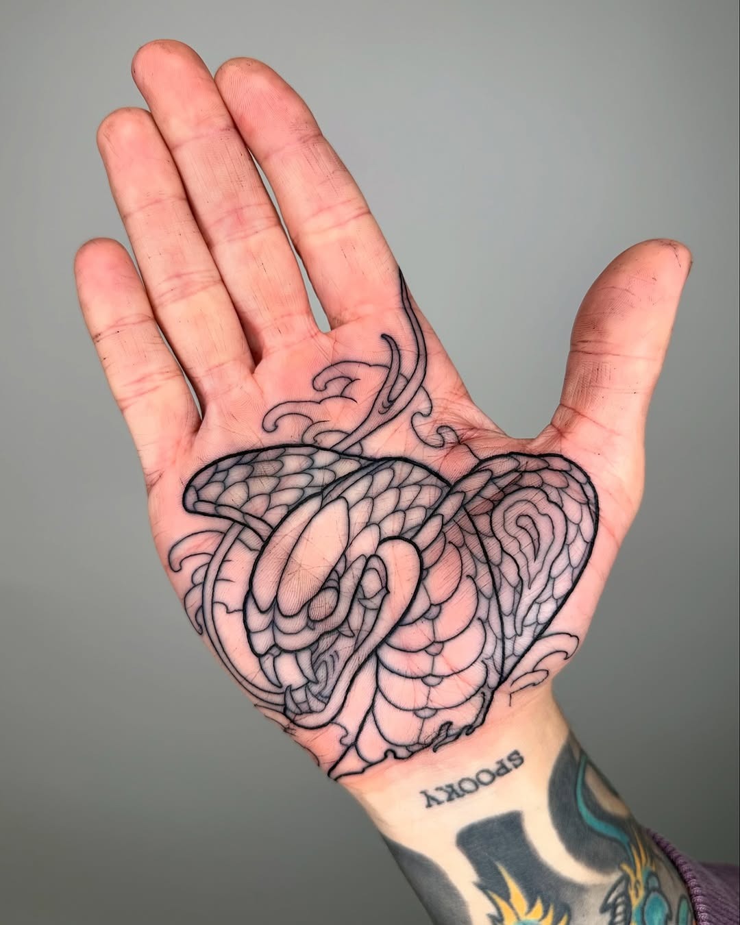 Intricate snake design on palm tattoo Tattoo Design