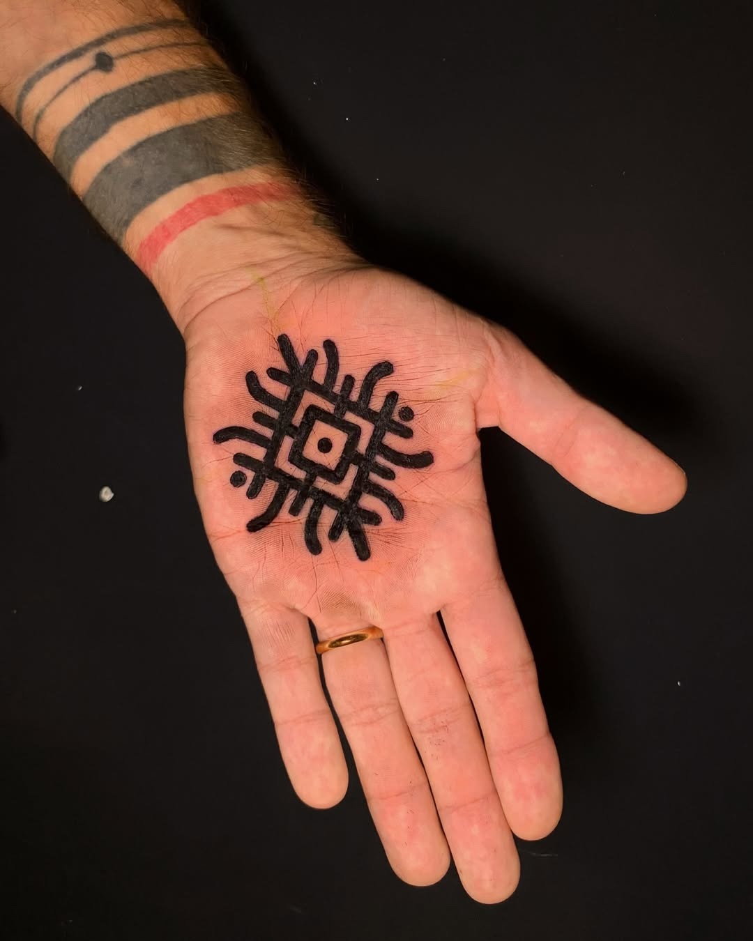 Striking black mandala palm tattoo design Tattoo Design
