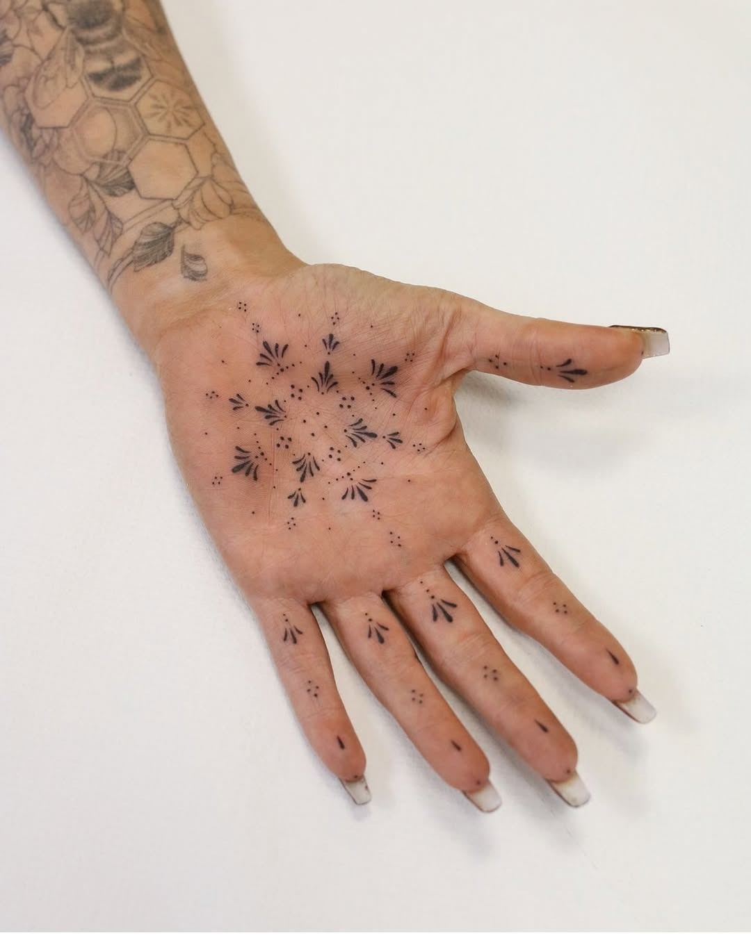 Unique palm tattoos with abstract designs Tattoo Design