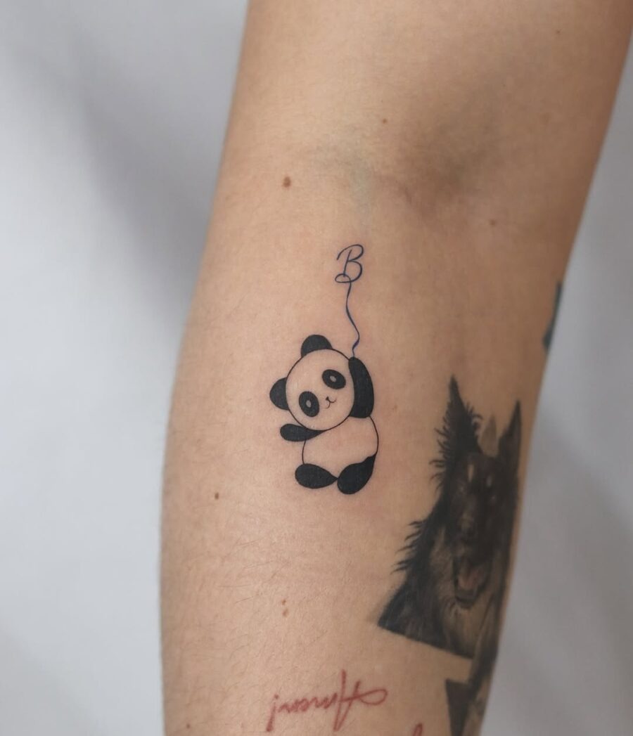 Adorable panda tattoo with a playful twist Tattoo Design