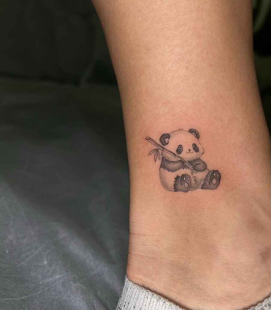 Adorable panda tattoo with playful charm Tattoo Design