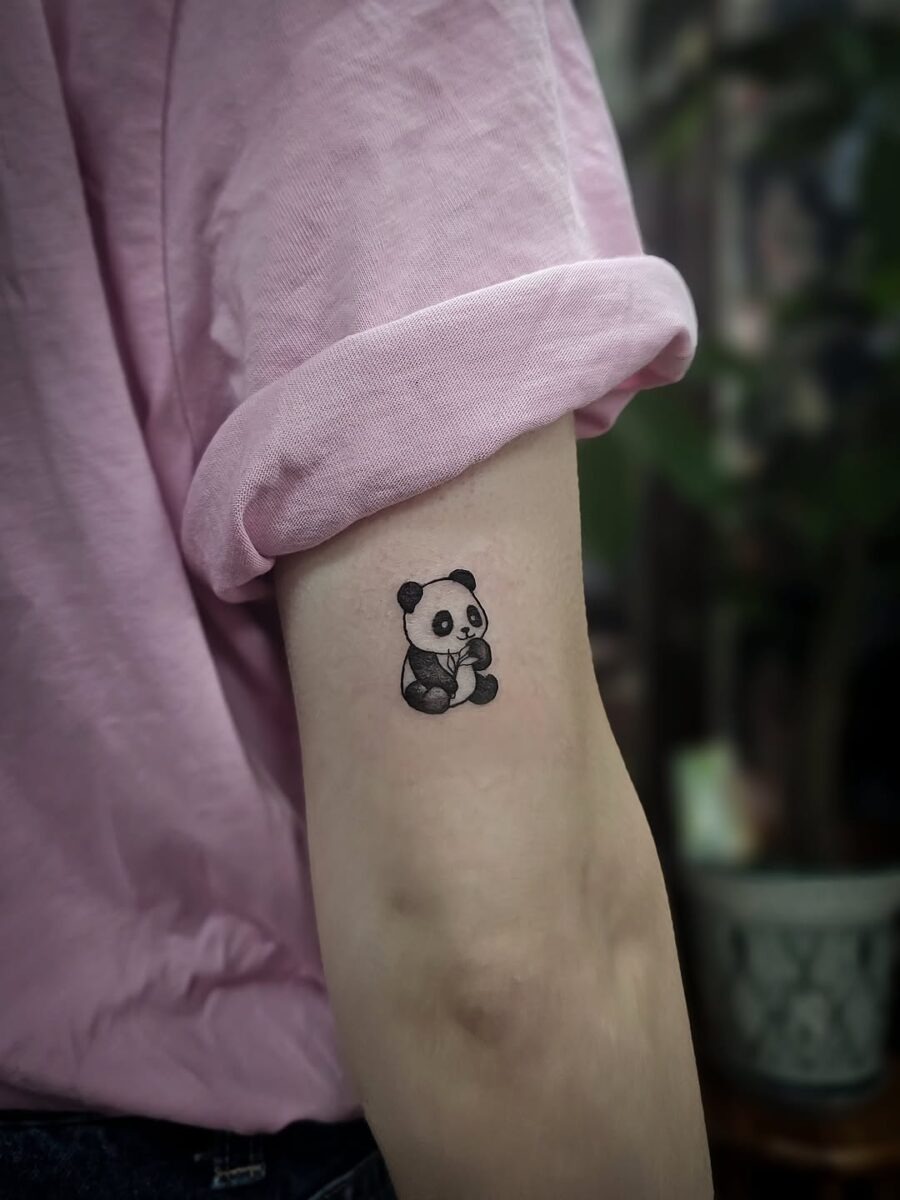 Charming panda tattoo on the arm Tattoo Design