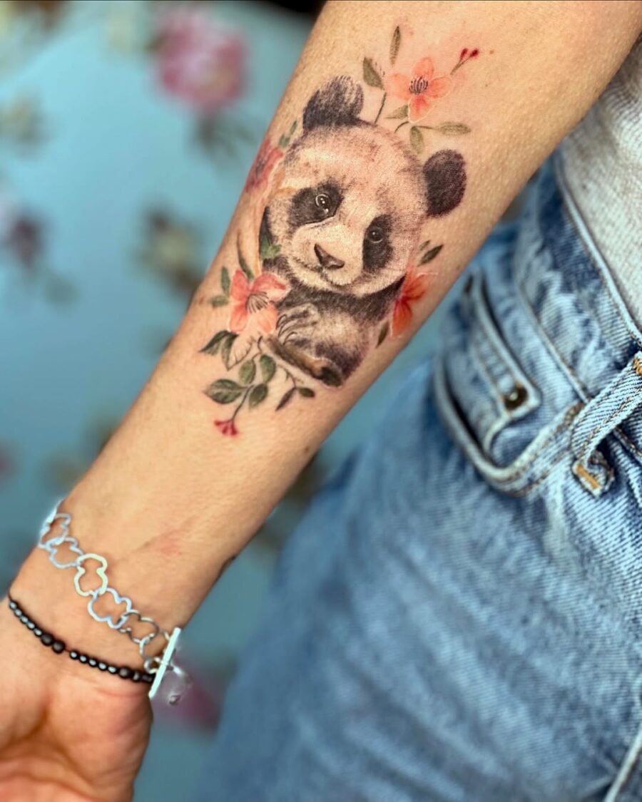 Charming panda tattoo surrounded by blossoms Tattoo Design