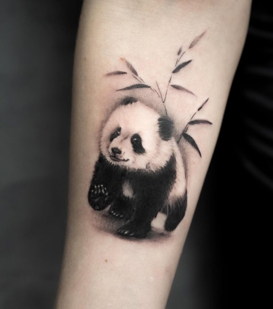 Charming panda tattoo with bamboo accent Tattoo Design