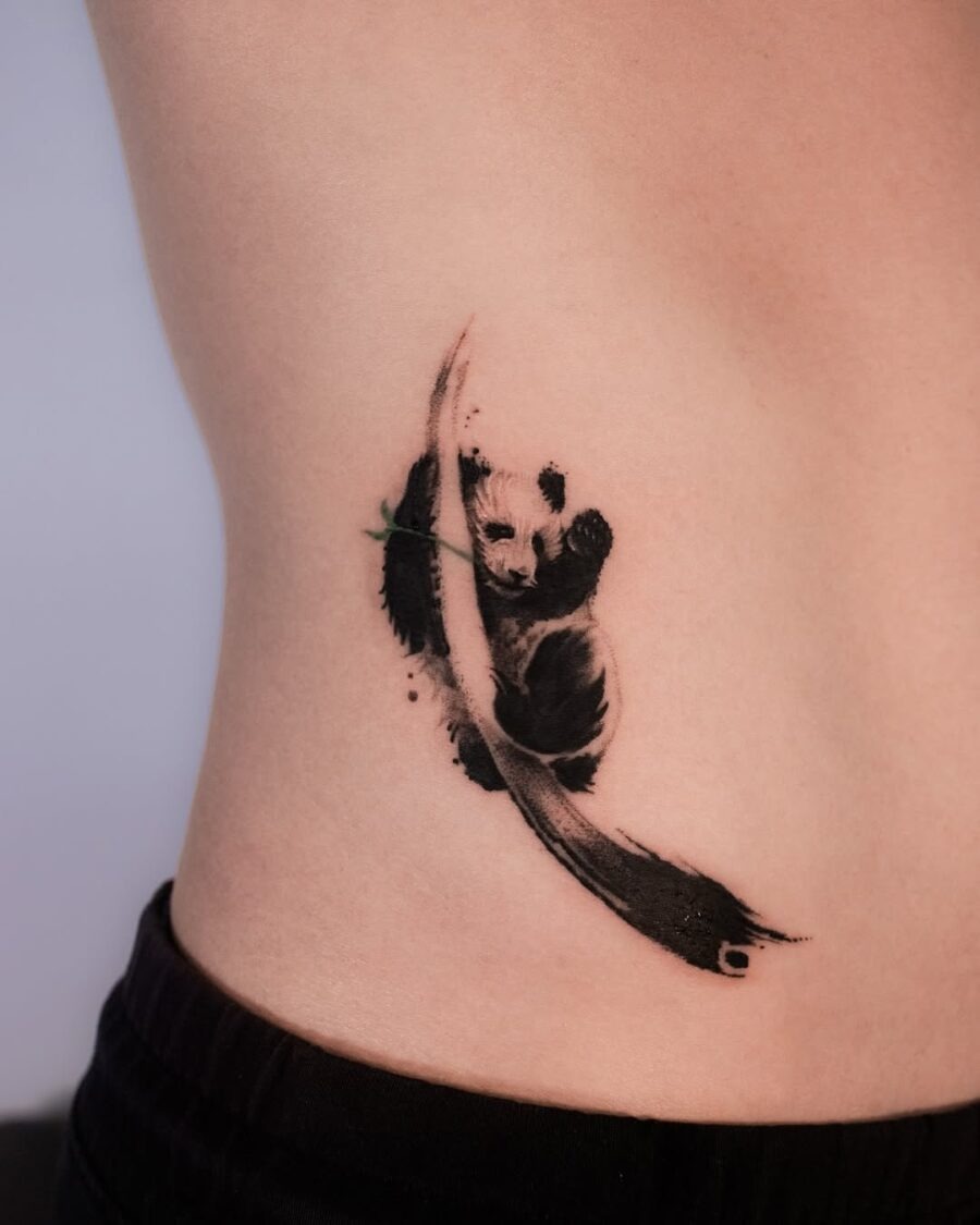 Elegant panda tattoo on the ribcage Tattoo Design