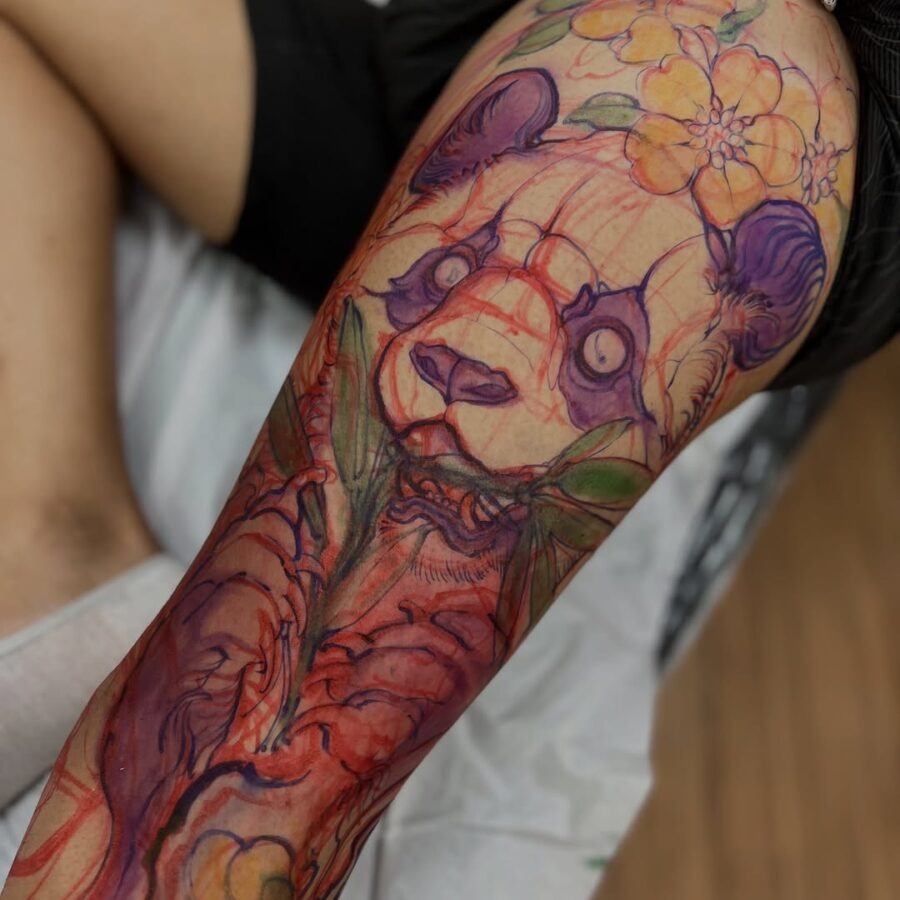 Vibrant panda tattoo with floral accents Tattoo Design