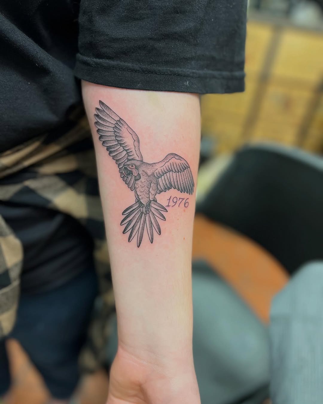 Stylish parrot tattoo with a vintage touch Tattoo Design