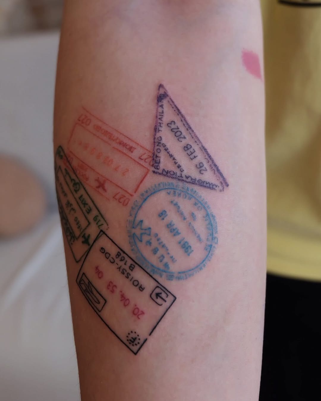 Colorful passport stamps inked on skin Tattoo Design