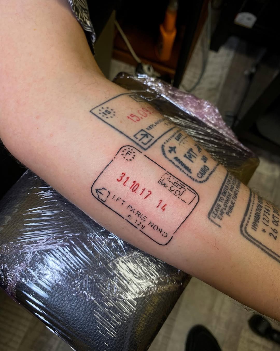 Creative passport stamp tattoo for travel lovers Tattoo Design