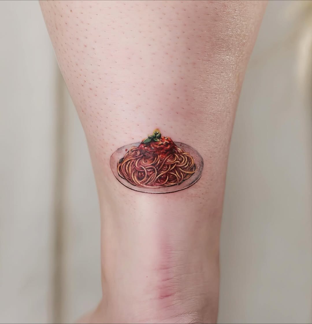 Realistic Spaghetti Tattoo on Ankle Tattoo Design