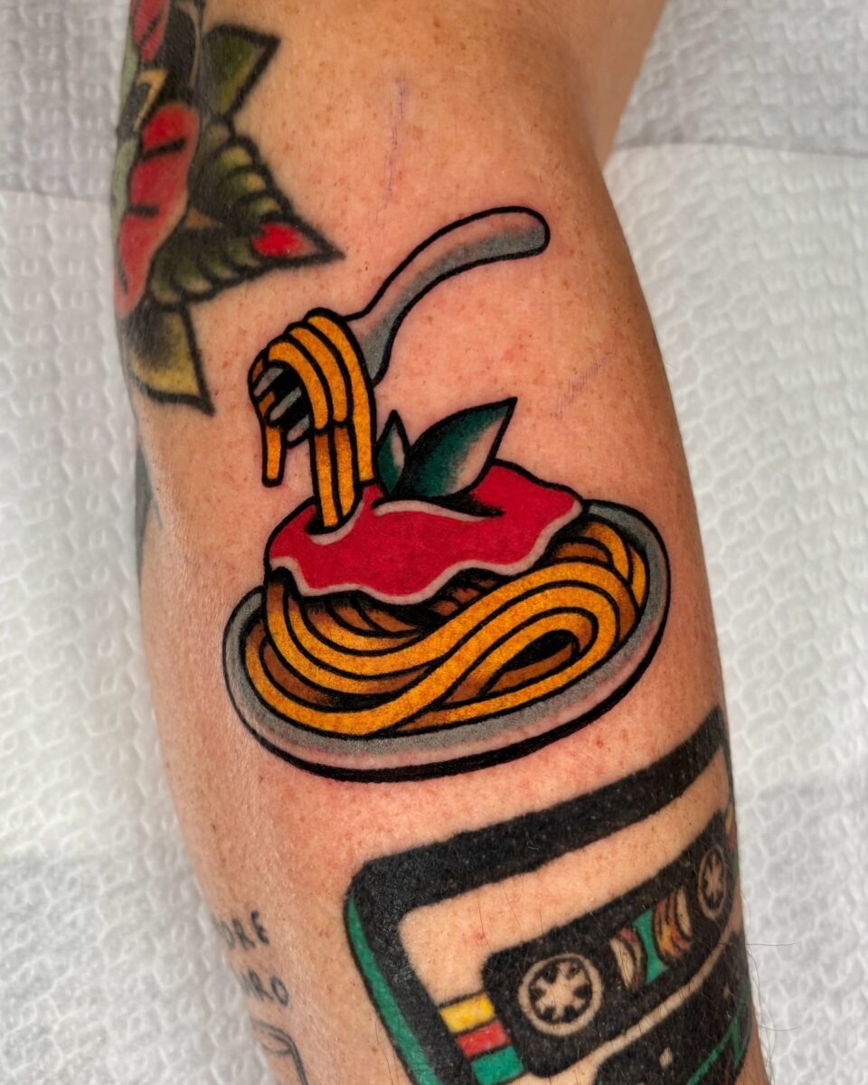 Vibrant spaghetti tattoo with playful details Tattoo Design