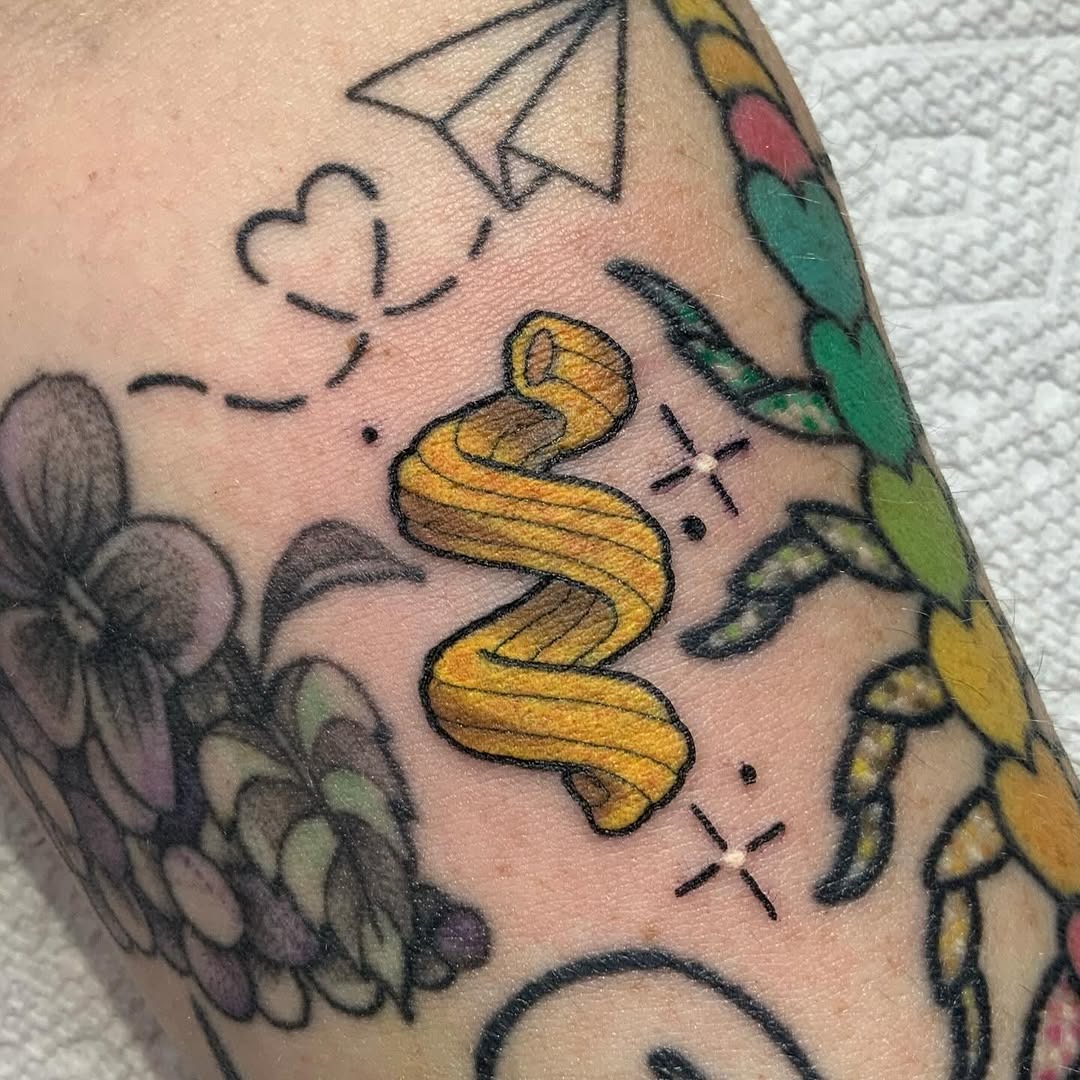 Whimsical yellow pasta design on forearm Tattoo Design
